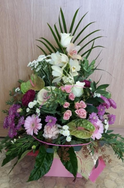 Pinks and Purples - Beautiful flowers arranged in a castle box in oasis pink and purple shades. Perfect for any occasion. 
