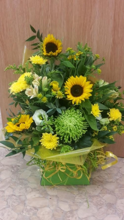 Castle Box in Yellows and Limes - A Striking Castle Box in yellows and limes arranged in a castle box already arranged in oasis so there is no need for a vase!. 

Flower content may vary due to availability and fresh stock. Order online or call us on T: 01948 661111 for more information