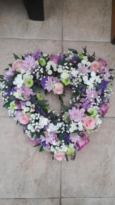 Pastel open Heart - A beautiful pastel open heart tribute. Call us for more information on T: 01948 661111 for more information on this product for sizes,  flowers and prices. 

15 " Start from £90.00

18" Start from £120.00

21" Start from £150.00 

Please choose the amount for the size you wish the product to be.