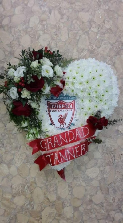 Liverpool Heart Tribute - A beautiful red rose heart tribute with A liverpool symbol in the centre. Call us for more information on T: 01948 661111 for more information on this product for sizes,  flowers and prices. 

15 " Start from £90.00

18" Start from £120.00

21" Start from £150.00 

Please choose the amount for the size you wish the product to be.