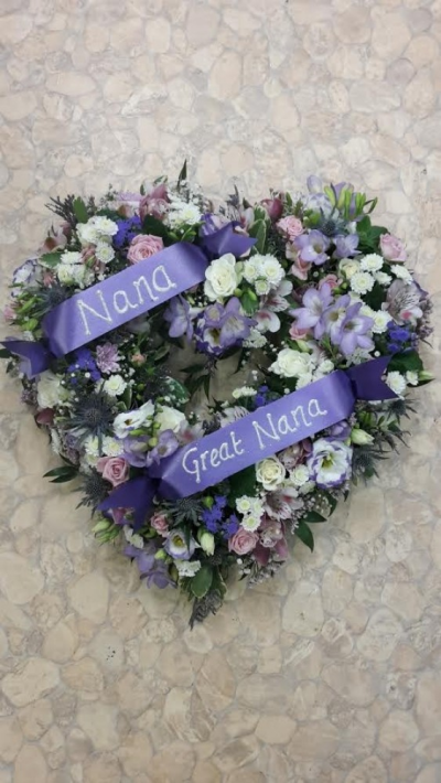 Nana open Heart - A beautiful Nana open heart tribute. Call us for more information on T: 01948 661111 for more information on this product for sizes,  flowers and prices. 

15 " Start from £90.00

18" Start from £120.00

21" Start from £150.00 

Please choose the amount for the size you wish the product to be.