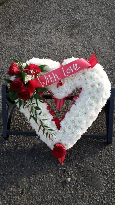 Red Rose open Heart - A beautiful red rose open heart tribute in Red and Purple, Bright mixed, and Pastel. Call us for more information on T: 01948 661111 for more information on this product for sizes,  flowers and prices. 

15 " Start from £90.00

18" Start from £120.00

21" Start from £150.00 

Please choose the amount for the size you wish the product to be.