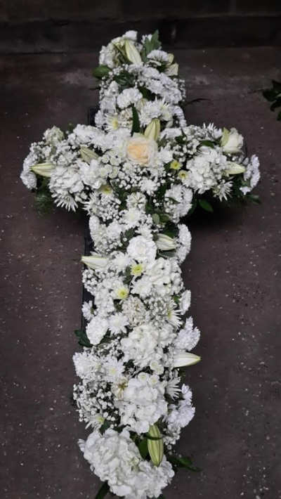 White Cross - A beautiful cross made up with all white flowers and greenery. Please call us on T:01948 661111 for more information on this funeral product. 

2FT Cross starts from £145.00

3FT Cross starts from £180.00

4FT Cross starts from £220.00

Please choose the amount for the size you wish the product to be.