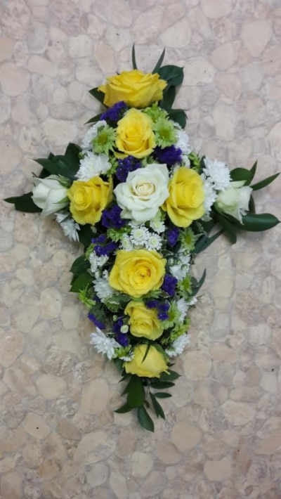 Yellow and White roses - A beautiful cross made up with Yellow and white roses with filler flowers and greenery . Please call us on T:01948 661111 for more information on this funeral product. 

2FT Cross starts from £145.00

3FT Cross starts from £180.00

4FT Cross starts from £220.00

Please choose the amount for the size you wish the product to be.