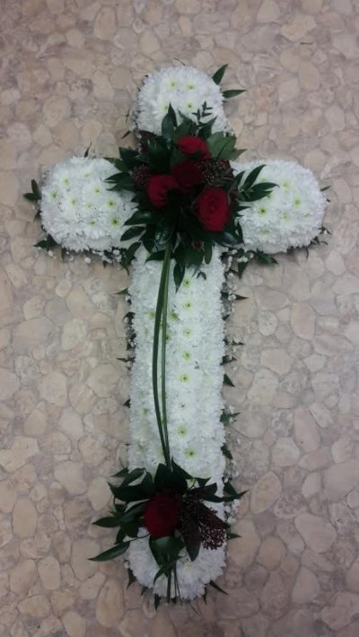 Red and White Funeral Cross - A beautiful cross made up with red roses white chrysanthemums and greenery. Please call us on T:01948 661111 for more information on this funeral product. 

2FT Cross starts from £145.00

3FT Cross starts from £180.00

4FT Cross starts from £220.00

Please choose the amount for the size you wish the product to be.