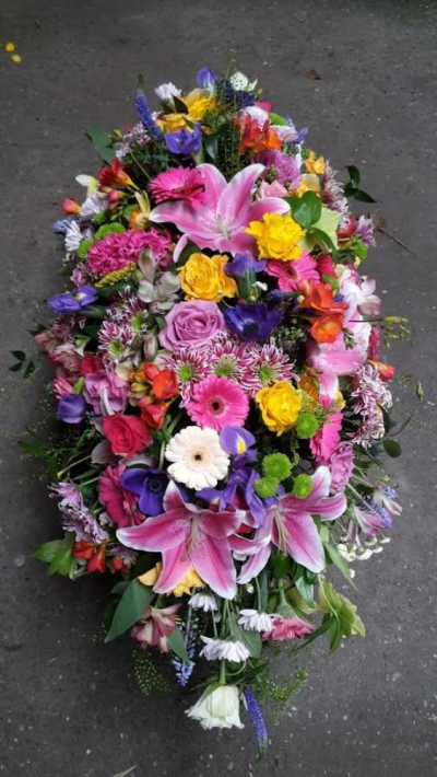 Bright mixed Coffin Spray - This coffin spray is a beautiful array of bright flowers in traditional flowers Please call us on T:01948 661111 for more information on this funeral product. 

3FT Sprays start from £150.00

4FT Sprays start from £250.00

5FT Sprays start from £450.00.

Please choose the amount for the size you wish the product to be.