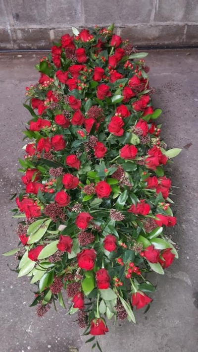Red Rose Coffin Spray - This coffin spray is full of red roses berries and red filler Please call us on T:01948 661111 for more information on this funeral product. 

3FT Sprays start from £200.00

4FT Sprays start from £300.00

5FT Sprays start from £550.00.

Please choose the amount for the size you wish the product to be.