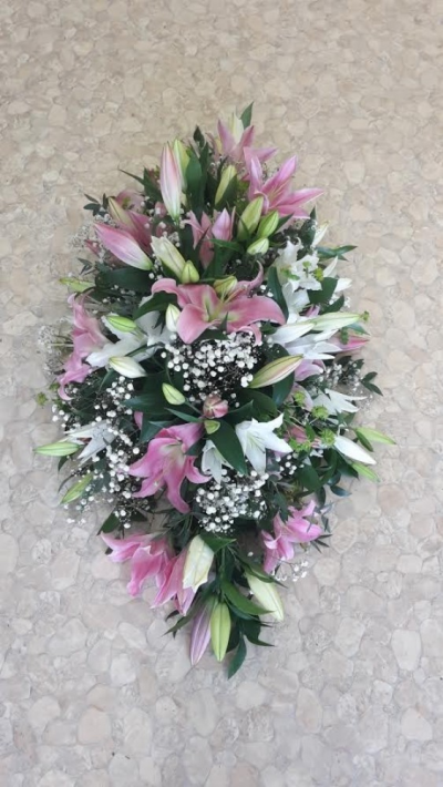 Pink and White Lily Coffin Spray - This coffin spray has beautiful Pink and white lilys with filler and greenary. Please call us on T:01948 661111 for more information on this funeral product. 

3FT Sprays start from £150.00

4FT Sprays start from £250.00

5FT Sprays start from £450.00.

Please choose the amount for the size you wish the product to be.