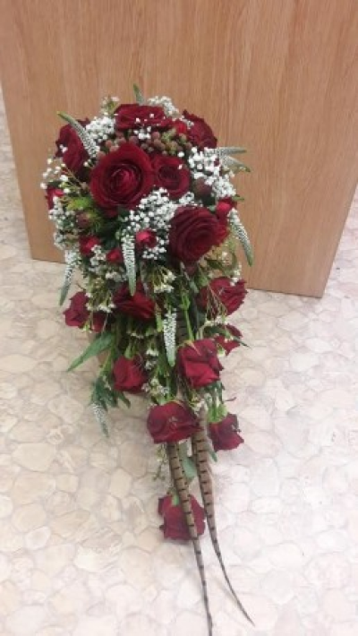 Red Rose Shower Bouquet - A stunning red rose with gypsophlia and other complementing filler Wedding Shower bouquet arranged in a holder.  Please call us on T: 01948 661111 for more information on flower content and sizes. 

Please give plenty of notice so we can make sure we have the correct fresh flower stock for your spray.