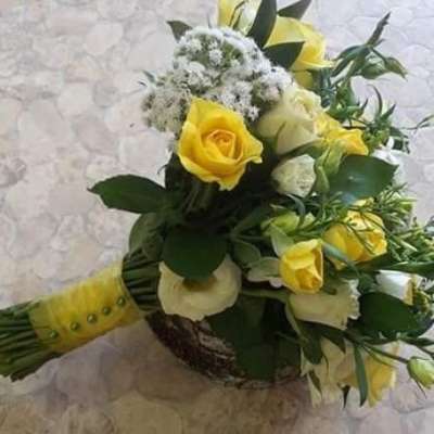 Yellow and White Wedding Posy - A beautiful wedding Posy in yellows and whites. Including Yellow roses and other white and cream complementing filler and greenery. 

Please call us on T: 01948 661111 for information on sizes and flower content. Please also give us plenty of notice for us to get the correct fresh flower content for your posy.