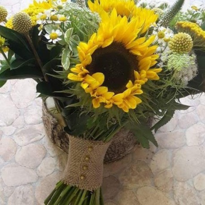 Sunflower Posy - A pretty Sunflower Wedding Posy with complementing filler and greenery. Please call the shop on T: 01948 661111 to discuss flowers content and sizes. Please also provide plenty of notice so we can make sure we get the correct fresh flower content for your posy.